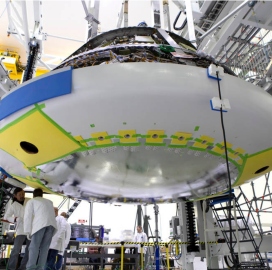 Lockheed, NASA Install Orion Spacecraft Heat Shield - top government contractors - best government contracting event